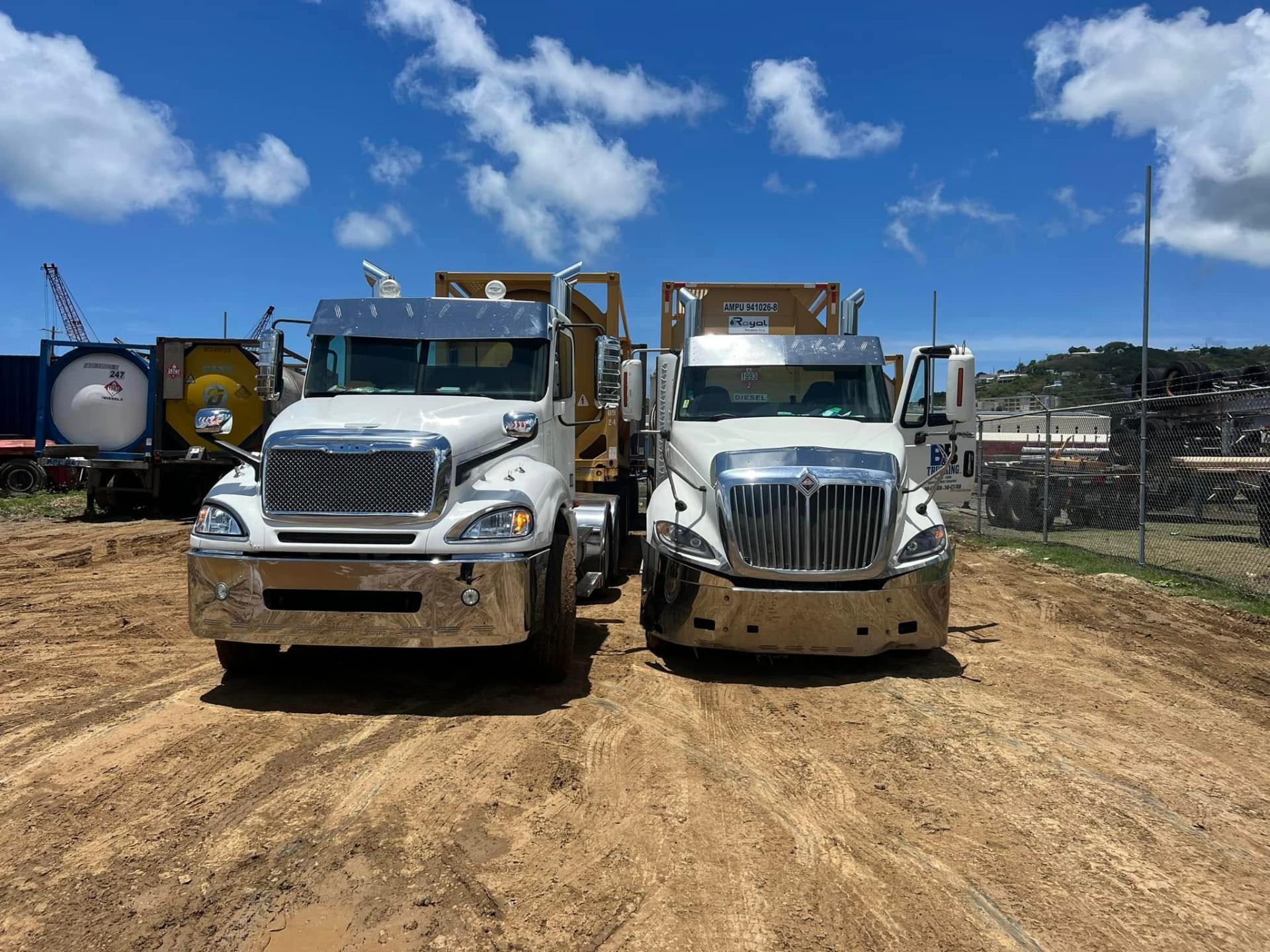 Two B&B Trucking trucks parked on site